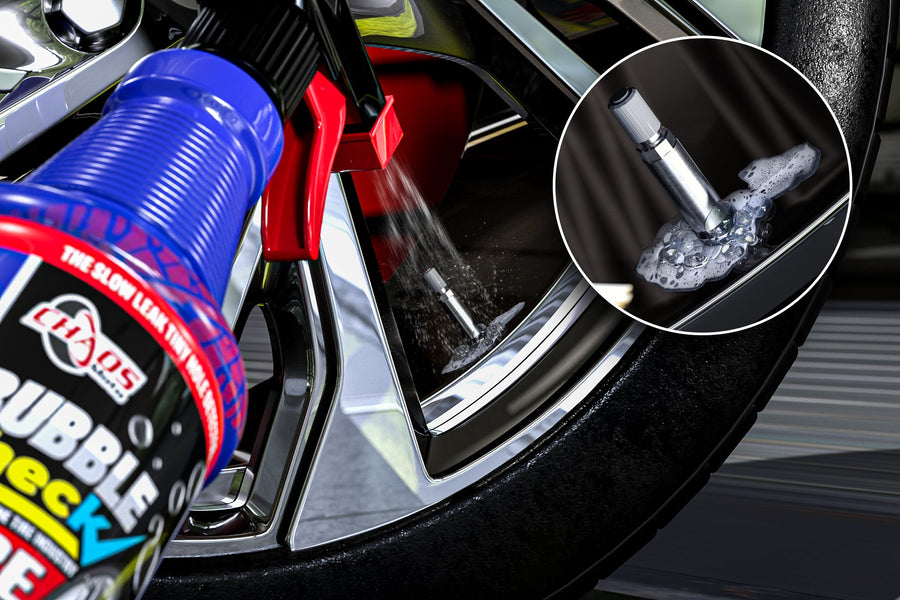 Bubble Check spraying a tire valve stem, bubbles revealing a slow valve leak