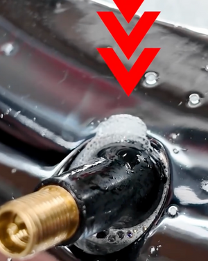 Real bubbles welling up at a leaking tire valve stem found with Bubble Check